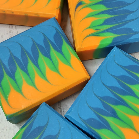 An orange, green, and blue bar of soap in a swirl pattern.