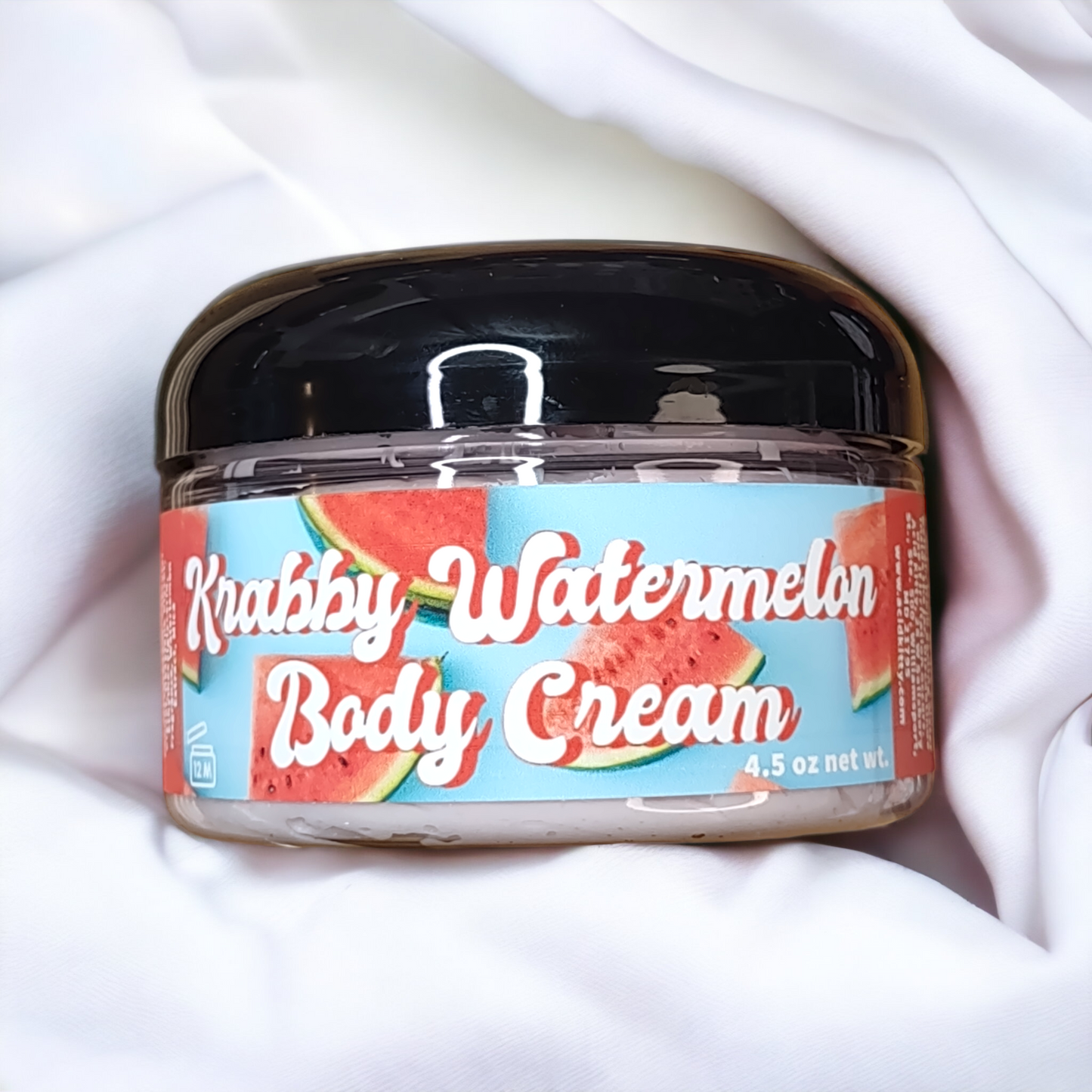 Krabby Watermelon Ultimate Body Cream packaging featuring watermelon slices on a blue background. 